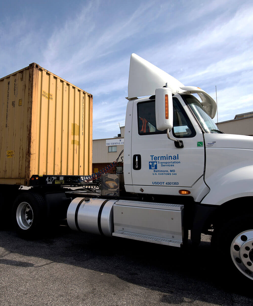 tractor with shipping container drayage