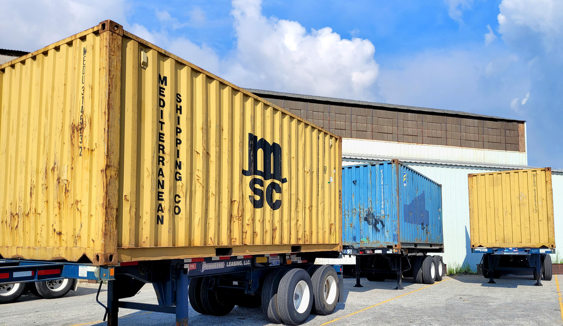 shipping containers parked in terminal yard