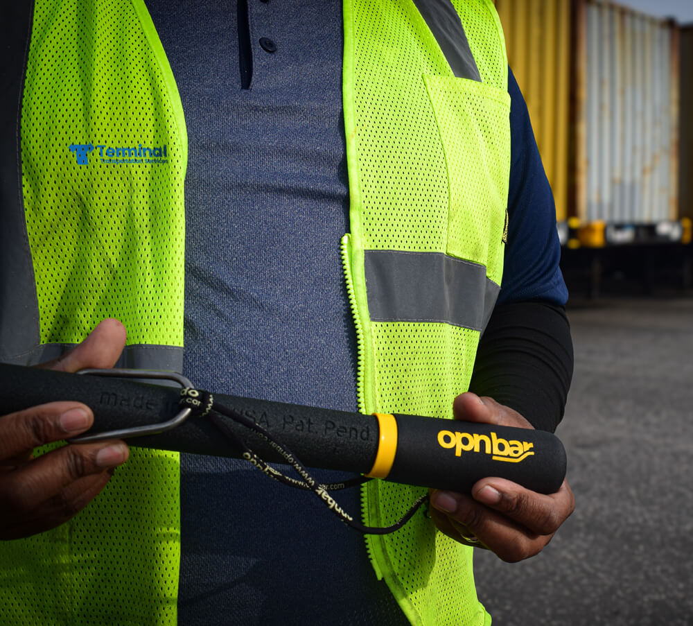 employee holding OPNBar door latch handle extender