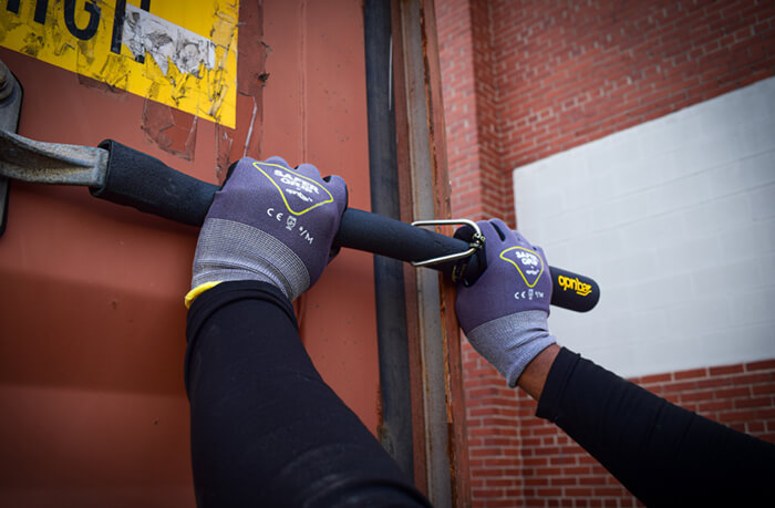 employee wearing safer grip gloves